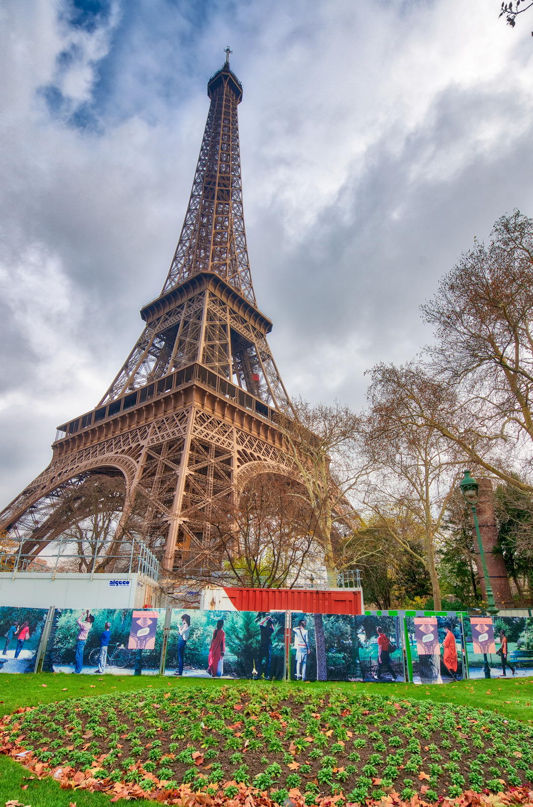 PARIS - DECEMBER 2012: Tourists visit Eiffel Tower. This is the most visited monument in France.